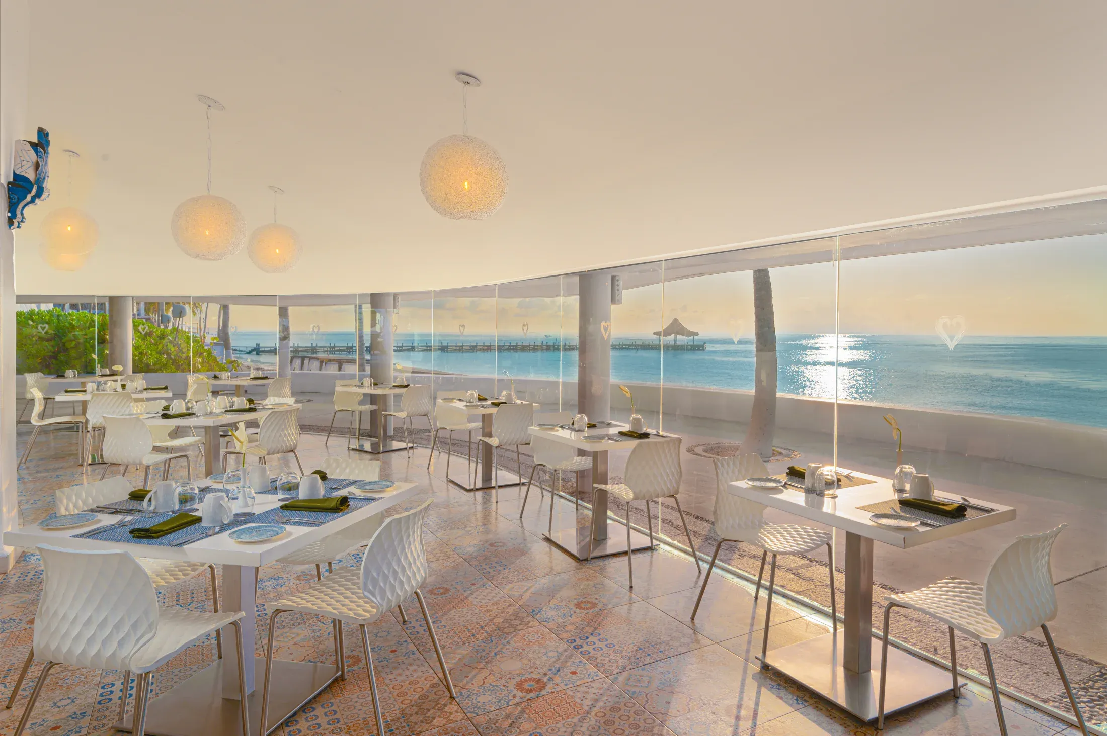 Oceanfront Aphrodite restaurant dining room at sunrise