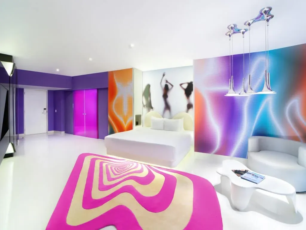 Lush Tower Oceanfront Suite with sitting area and colorful contemporary decor