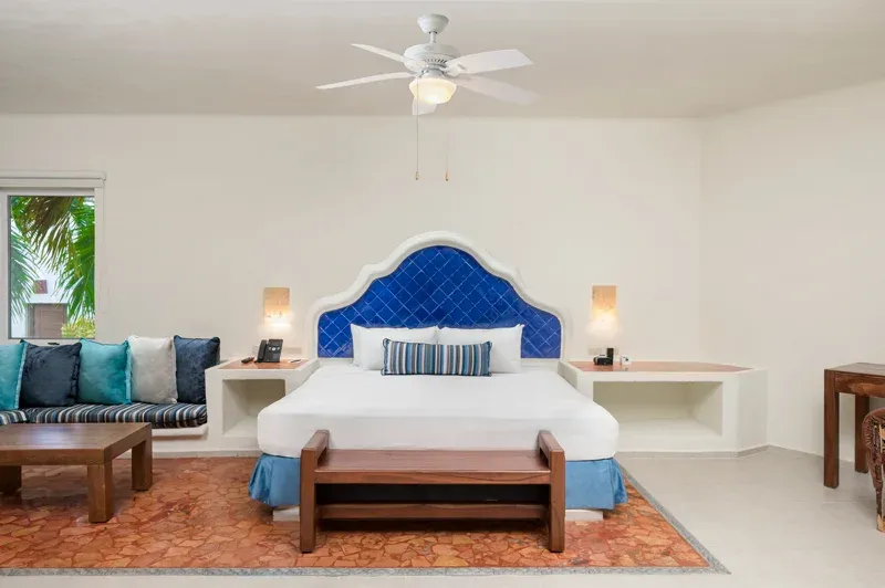 Master Suite bedroom with king bed and blue accents