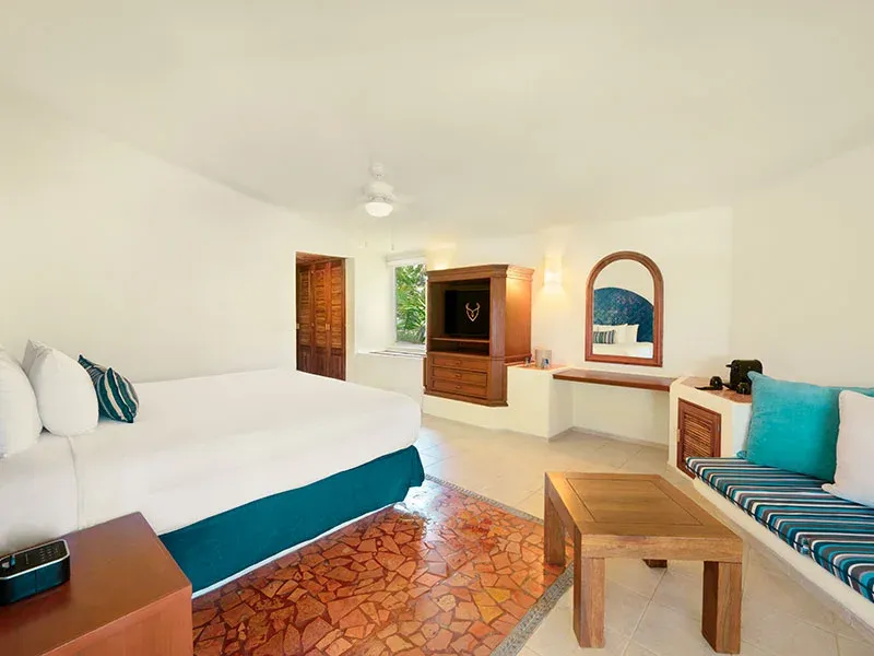 Ocean View Room interior with king bed and built-in sitting area