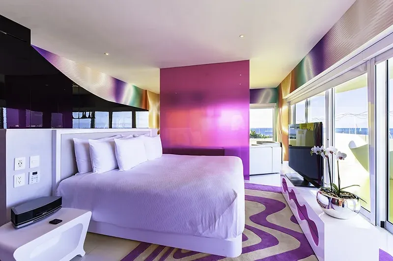 Temptation Oceanfront Master Suite bedroom with wraparound windows