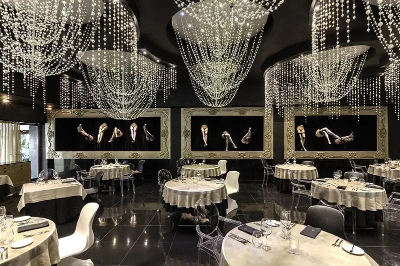 Pearl restaurant dining room with sculptural crystal chandeliers